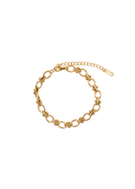 18K gold dip stainless steel chain link bracelet from The Kennebunkport, featuring a versatile design for any event. Adjustable to approximately 6.3 inches with a 2-inch extender for a perfect fit, combining sophistication and durability