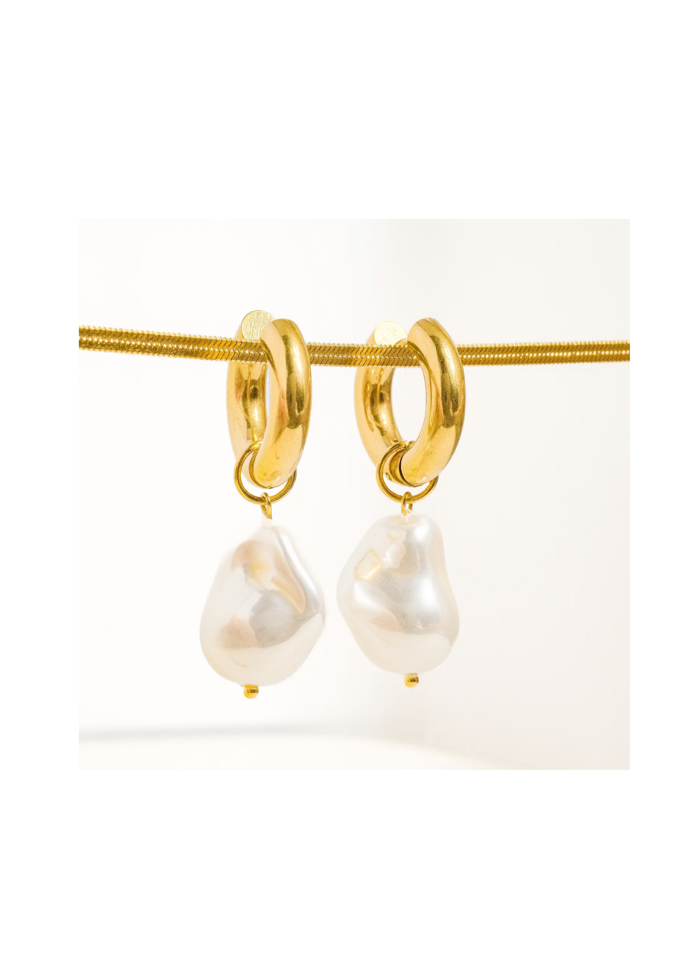 1 x 0.6-inch Greenwich Oceana Gold Statement Large Pearl Earrings with 18K gold plating. Non-tarnish, stainless steel huggie droplet design for lasting radiance and versatile style