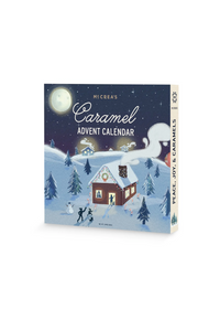 McCrea's caramel advent calendar with winter holiday-themed packaging, featuring a cozy snow-covered cabin under a starry sky