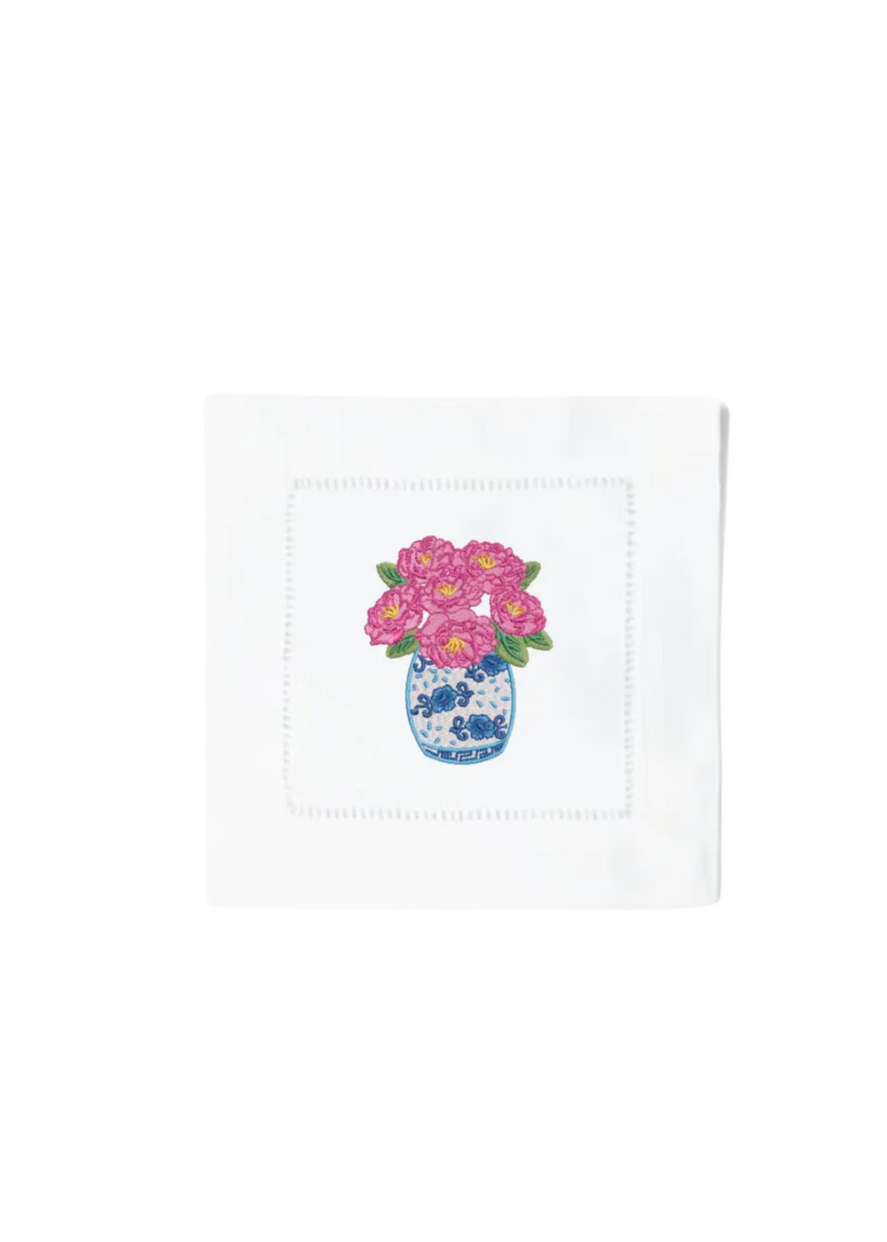 White napkin with embroidered vase of pink peonies, featuring intricate blue and white vase design